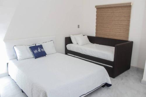 Postel nebo postele na pokoji v ubytování VILLA 2 COSTA FELIX