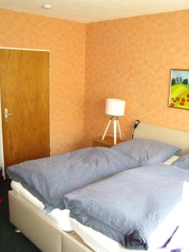 Katil atau katil-katil dalam bilik di Bio-Hotel Zum Forsthaus