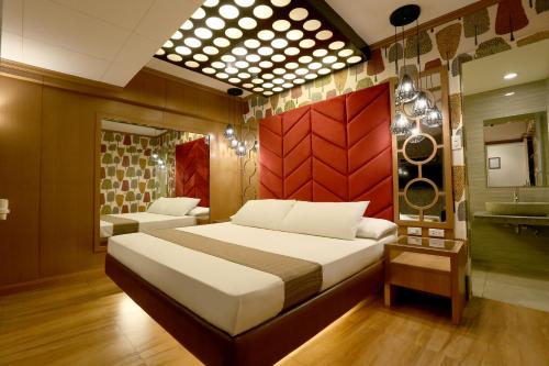 Hotel Ava Gil Puyat tesisinde bir odada yatak veya yataklar
