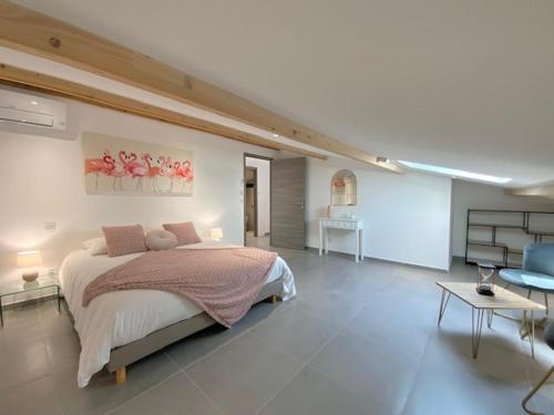 a bedroom with a large bed and a living room at La Listrella Residence & Spa in Monticello