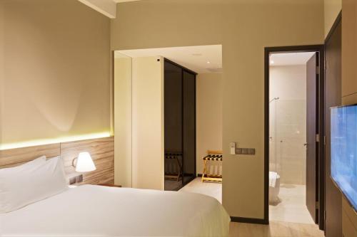Ένα ή περισσότερα κρεβάτια σε δωμάτιο στο Louis Kienne Serviced Residences - Havelock