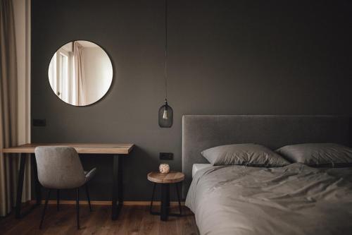 Postel nebo postele na pokoji v ubytování Pitzner - Winery & Suites