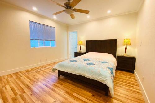 a bedroom with a bed and a ceiling fan at Entire 3 bedroom house for 6 people Near SFO SF Bay Area Newly updated in San Bruno