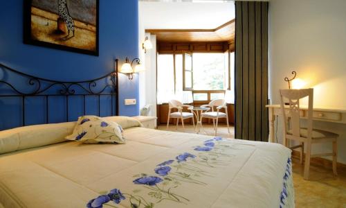 מיטה או מיטות בחדר ב-Hotel Rural La Corte de los Pinares