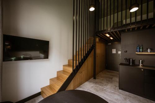 Televízia a/alebo spoločenská miestnosť v ubytovaní TOP Garden Aparthotel