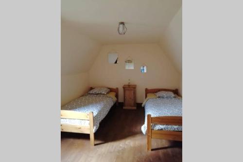 A bed or beds in a room at Gite la Balme