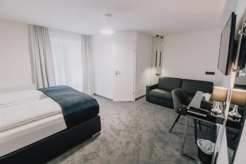Кровать или кровати в номере The Place Boutique & Design Hotel Flachau