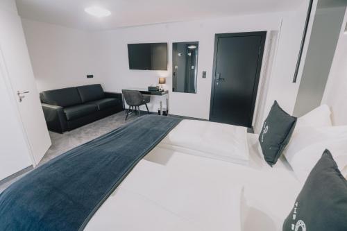 Кровать или кровати в номере The Place Boutique & Design Hotel Flachau