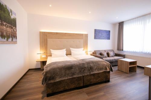 Lova arba lovos apgyvendinimo įstaigoje Landgasthof-Hotel Zum Steverstrand
