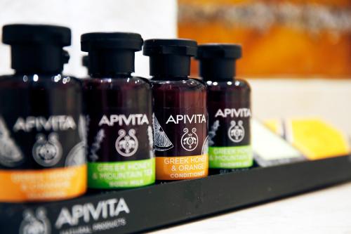 a group of four bottles of antivan on a shelf at Siora Vittoria Boutique Hotel in Corfu Town