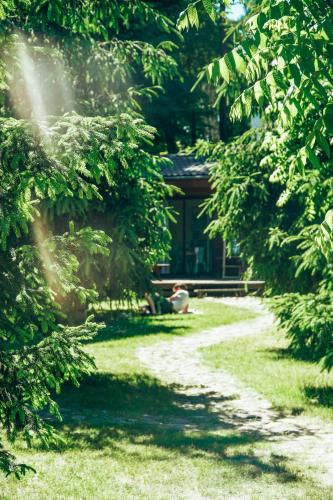 a path in front of a house with trees at Lake Park Łagów in Łagów