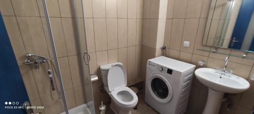 a small bathroom with a toilet and a sink at Carpe diem in Galatas