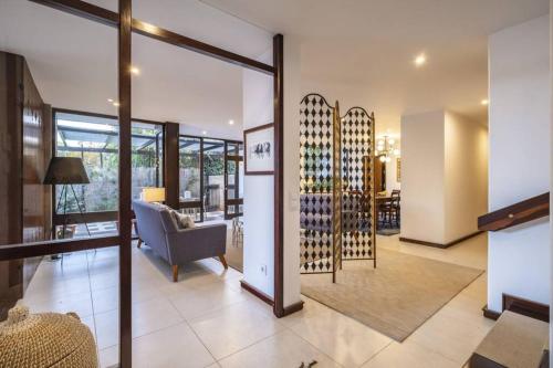 a living room with a bunch of wine bottles at Charming Villa, spacious, beautiful views! in Funchal