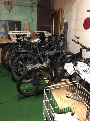 a group of bikes parked in a garage at Hotel des Alpes in Die