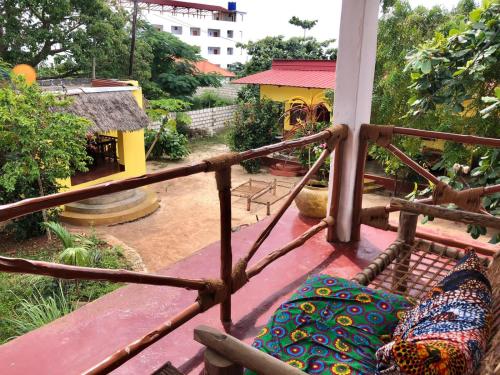 a view of a balcony with a couch on a porch at Magharibi House in Nungwi