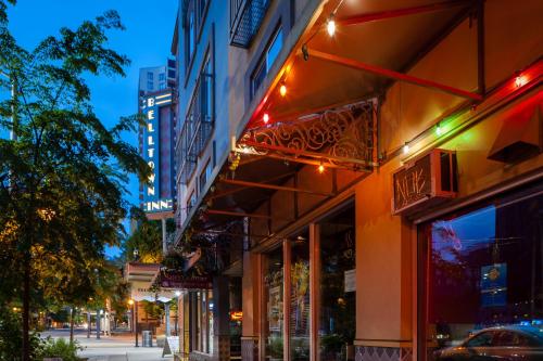 a store with lights on the side of a street at Belltown Inn in Seattle