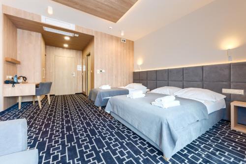 Postel nebo postele na pokoji v ubytování Hotel Wena