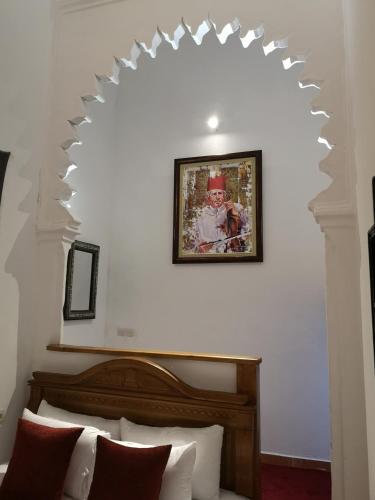 Ένα ή περισσότερα κρεβάτια σε δωμάτιο στο Riad & Café culturel BAB EL FAN