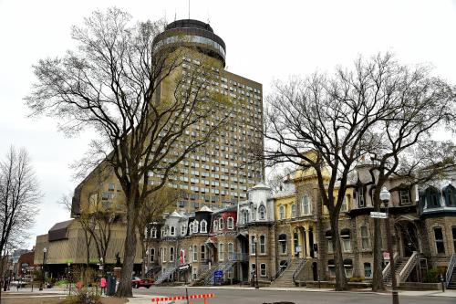 a group of buildings with a tall building at Hôtel Le Concorde Québec in Quebec City