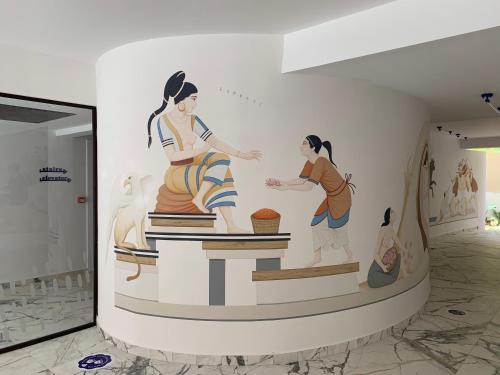 a wall mural of two women in a museum at Pavo Art Hotel in Heraklio Town