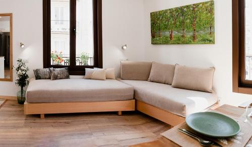 a living room with a couch and a table at Casa Miño in Ourense