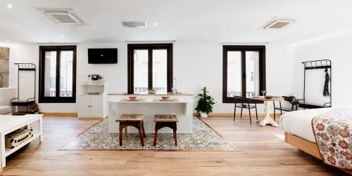 a bedroom with a bed and a sink in a room at Casa Miño in Ourense