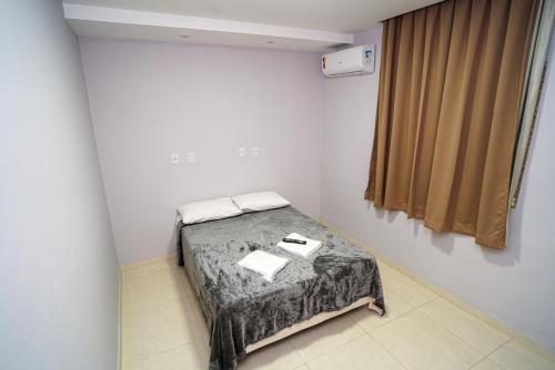 Ένα ή περισσότερα κρεβάτια σε δωμάτιο στο Hotel Diamantte