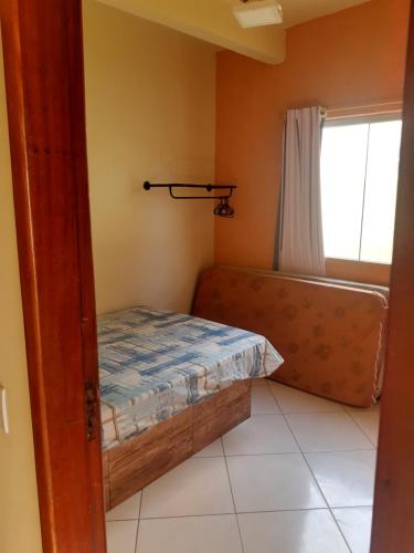 Giường trong phòng chung tại Hospedagem Praia do Pontal, Arraial do Cabo