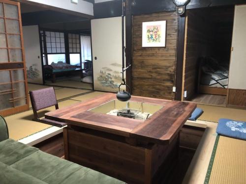 a kitchen with a wooden island in a room at Cafe Restaurant Umi no Yado Awaji Island - Vacation STAY 61253v in Awaji