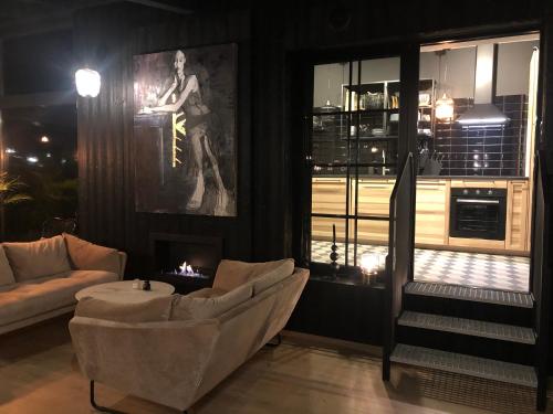 Kuchyň nebo kuchyňský kout v ubytování WILLA MAGNOLIA - Apartamenty i Pokoje - ROWERY, POKÓJ ZABAW, KAWA Z EKSPRESU