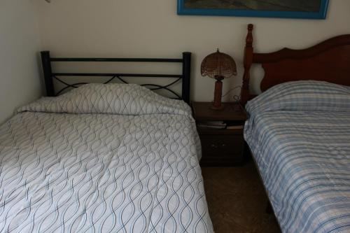 Katil atau katil-katil dalam bilik di Hermosa Residencia Costa Azul Acapulco