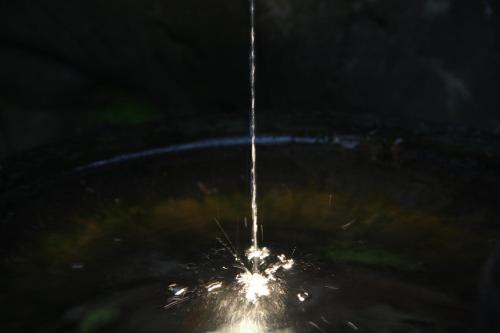 a close up of a object in the water at night at Ryokan Shinsen in Takachiho