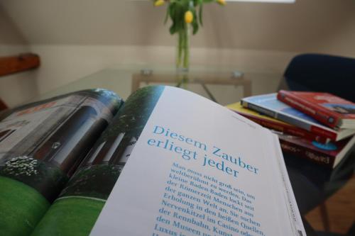 a book sitting on top of a pile of books at Ferienwohnung Habitat in Gaggenau