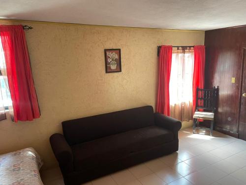 Ein Sitzbereich in der Unterkunft Hotel Hacienda de Cobos