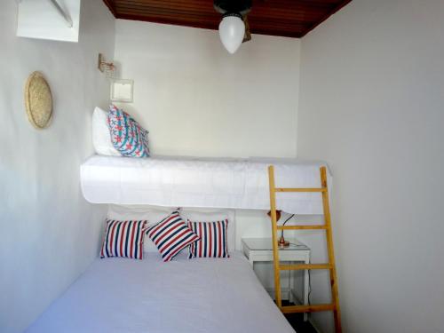 En eller flere senge i et værelse på VIVA BUZIOS no Condominio Aqua Marina casa3