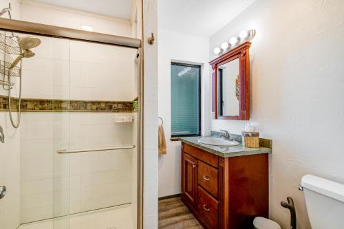 a bathroom with a shower and a sink at Captain's Quarter in Johnson Landing