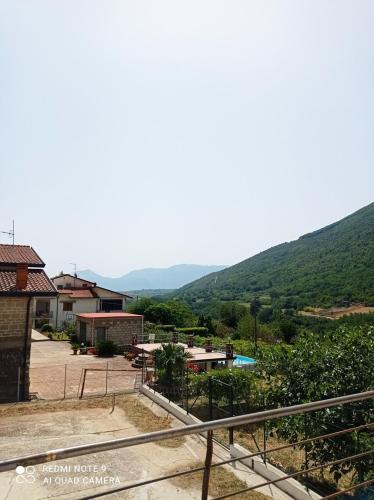 a view of a resort with mountains in the background at La Carrozza sul Titerno in Faicchio