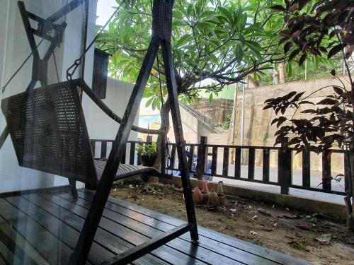 a swing on the porch of a house at 17 Happiness in Xiaoliuqiu