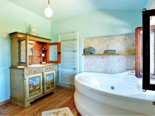 a large bathroom with a tub and a sink at Elegant Villa in Montecosaro Italy with Jacuzzi in Montecosaro