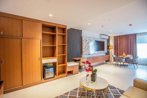 a living room with a couch and a table at Solano Hotel in Lipa