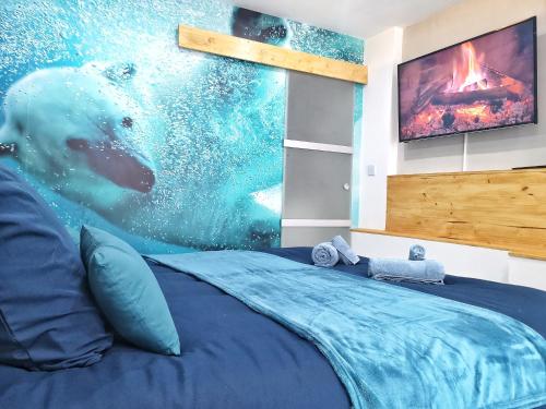 a bedroom with a polar bear swimming in the water at ☆ OURS & SPA ☆ COSY ☆ MAGIC ☆ LOCBNB ☆ in Barr