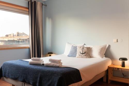 Ένα ή περισσότερα κρεβάτια σε δωμάτιο στο The Refreshing Seaside Home