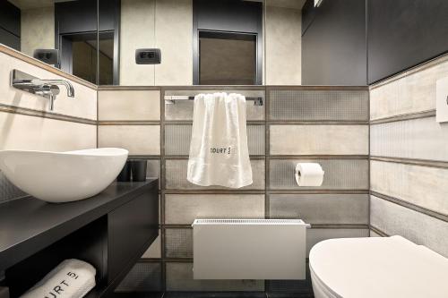 a bathroom with a toilet and a sink at Court 5 in Zagreb