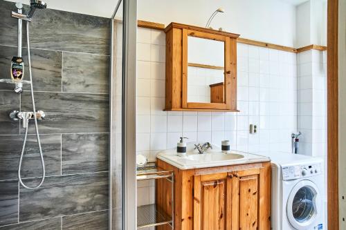 a bathroom with a sink and a shower at Apartment Fuchswald in Lackenhof