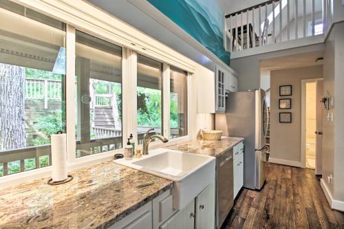 a kitchen with a sink and a refrigerator at Wintergreen Resort Home with 2 Decks and Ski Access! in Roseland