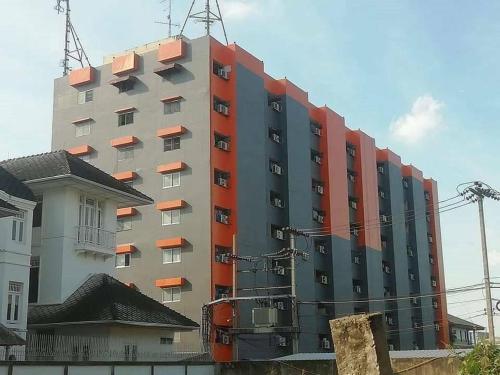 a tall building with cranes on top of it at PRL Place in Bangkok