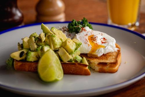 a plate of food with an egg on top of toast at Brewhouse and Kitchen in Worthing