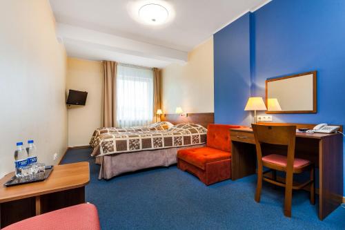 Posteľ alebo postele v izbe v ubytovaní Hotel Olivia
