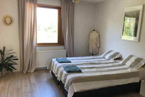 Кровать или кровати в номере Villa Edengård, next to Lohja lake