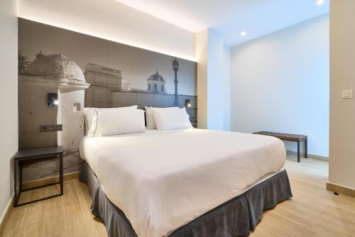 Ένα ή περισσότερα κρεβάτια σε δωμάτιο στο Tandem Pópulo